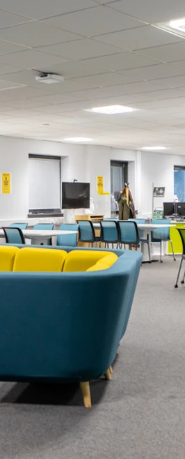 Bright and modern library and flexible learning centre at Glasgow Kelvin College Easterhouse Campus, featuring computers, group tables, and colourful seating.  Bright and modern library and flexible learning centre at Glasgow Kelvin College Easterhouse Campus, featuring computers, group tables, and colourful seating.